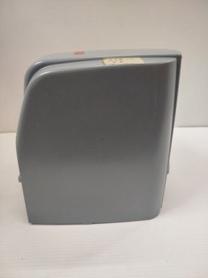 a gray suitcase that is sitting on a table