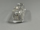 a clear piece of glass sitting on top of a table