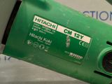a close up of a green machine with a label on it