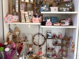 a room with a lot of stuff on the shelves
