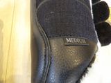 a close up of a pair of shoes on a wooden floor