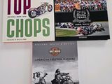 three books that are on top of a table