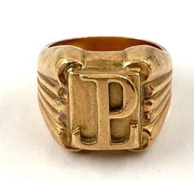 an image of a gold ring with the letter p on it