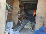 an image of a garage with a lot of junk inside of it