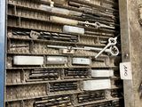 a lot of tools that are sitting on a shelf