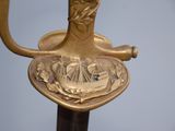 a close up of a sword with a design on it