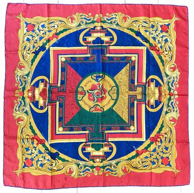 a close up of a red and blue cloth with a design on it