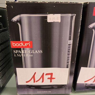 boxes of kitchen appliances on a shelf in a store