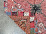 a heart shaped piece of fabric with a design on it