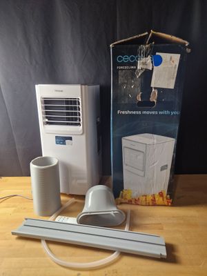 a box of air conditioner sitting on a table next to a box of air conditioner