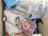 a cardboard box filled with toys and other items