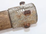 a close up of an old hammer with rust on it