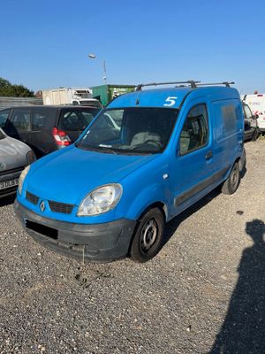 a blue van that is parked in a parking lot