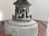 a lamp that is sitting on a table with a lamp shade on top of it
