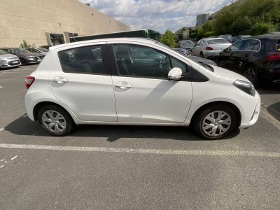 a picture of a white car parked in a parking lot
