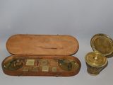 a small wooden case with a pair of glasses in it