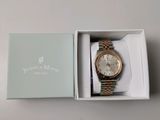 a box with a watch inside of it on a table