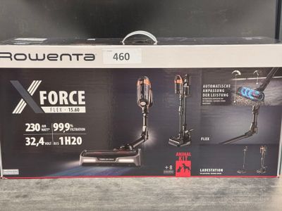 the box is open on the table with a vacuum in it