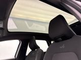 the interior of a car with a sunroof and a view of the road