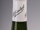 a bottle of wine that is sitting on a table