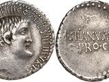 a silver coin with an image of a woman on it