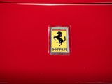 a close up of a ferrari badge on a red car