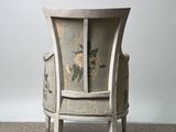 a chair that has been painted with flowers on it