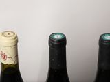 three bottles of wine that are sitting on a table