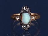 une image représentant une bague en or sertie d'un oplite et de diamants
