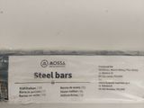a roll of steel bars wrapped in plastic on a white surface