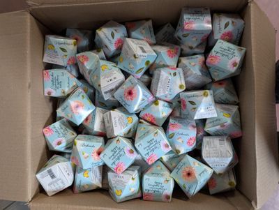 a box full of soaps that are sitting on the floor