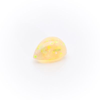 a yellow oplite stone with a white background