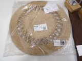 a straw hat that is wrapped in plastic on a table