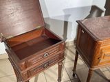 two wooden tables with drawers on them in a room