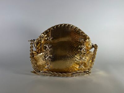 gold snake skin purse with chain strap on white background
