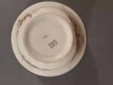 a white plate and a white bowl on a table