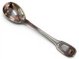 silver spoon on a white surface with a silver handle