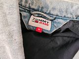 a close up of a denim jacket with a tommy jeans label on it