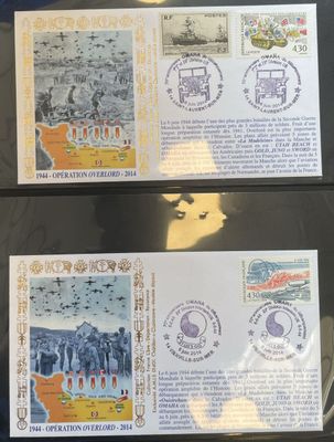 two stamps with a picture of elephants on them are on a table