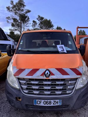 an orange van that is parked in a parking lot