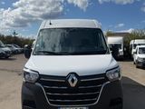 the white van is parked in a parking lot with other vehicles