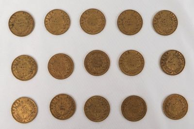a lot of coins that are on a white surface
