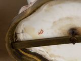 a close up of a glass vase with a stick in it