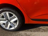 a close up of a car ' s wheel on the street