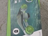 a box that has a green and white device inside of it