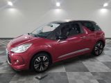 the red citrole is parked in a large room with a checkered floor