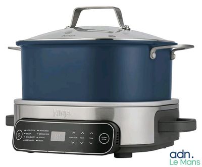 a large blue pot sitting on top of a stainless steel stove