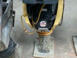 a machine that is sitting on the ground in the garage