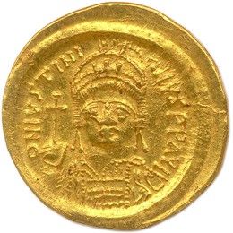 une pièce d'or à l'effigie d'une femme
