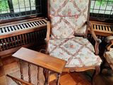 a chair and a table in the corner of a room